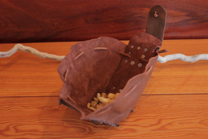 
                  
                    Fully expanded brown leather handmade pouch. Pouch has leather drawstring, flat rivets and spacious opening.
                  
                