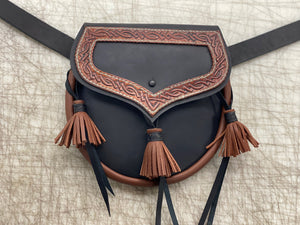 
                  
                    Black and brown Rob Roy Leather Sporran pouch with three leather tassels and tooled leather knotwork detail.
                  
                